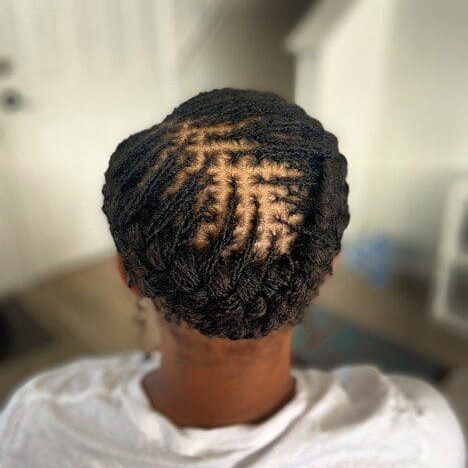 Intricate braided hairstyle with a unique pattern on the back of the head.